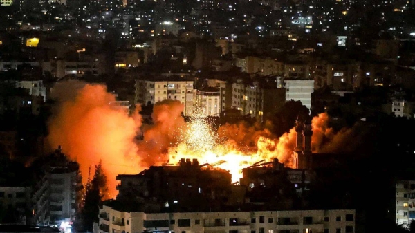 Smoke and fire erupt from the site of an Israeli airstrike on Beirut's southern suburbs on June 5