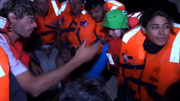 This handout image from Israel's foreign ministry shows Freedom Flotilla Coalition aid activists, including Greta Thunberg in the green hat, after their vessel was boarded by the Israeli military