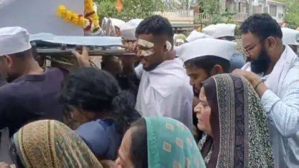 Air India crash survivor attends the funeral of his brother, who died in the air crash