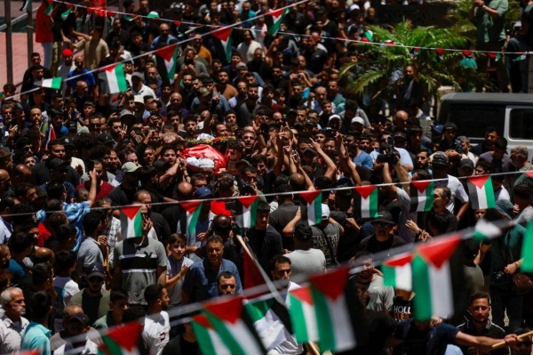 People carry the body of Saif Musallet during his funeral near Ramallah, in the Israel-occupied West Bank on Sunday
