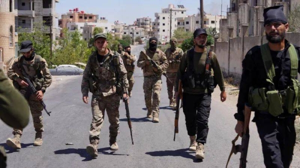 The Syrian president says government forces had expelled 'outlawed groups' in Suweida city