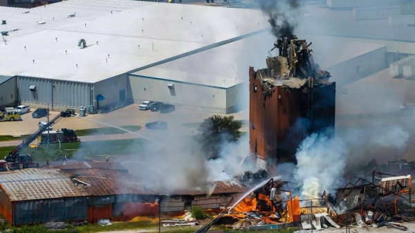 Firefighters battle a fire after an explosion in an industrial area in Fremont, 29 July