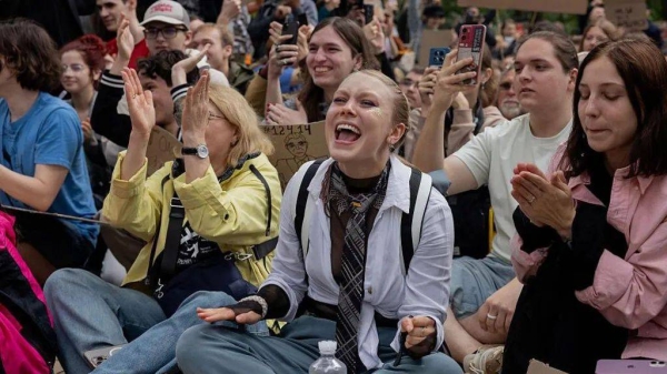 Young Ukrainians were outside parliament again on Thursday as MPs voted to overturn a controversial law