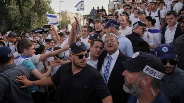Surrounded by security guards, Israel's far-right National Security Minister, Itamar Ben-Gvir, center, participates in march marking Jerusalem Day, Monday, May 26, 2025
