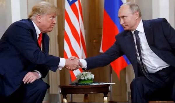 President Donald Trump and Russian President Vladimir Putin shake hands at an earlier meeting.