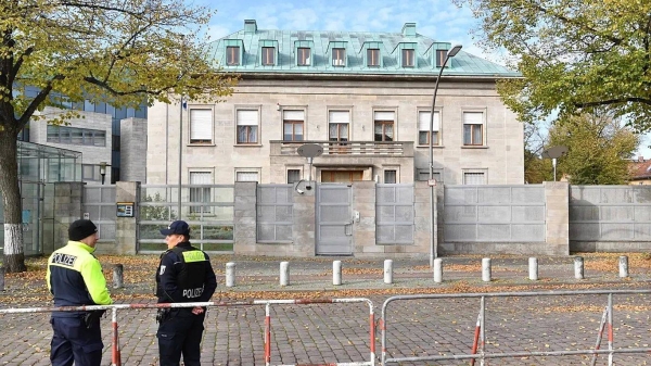 Police officers stand by the Israeli embassy in Berlin