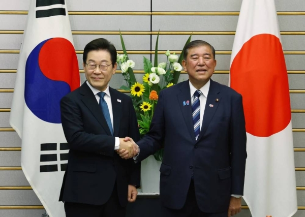 South Korea, Japan vow to move past disputes as leaders hold first summit in 17 years