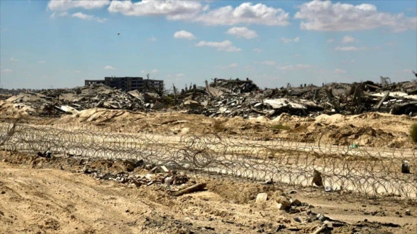 Near the new GHF aid site, rubble lies strewn around the city of Rafah