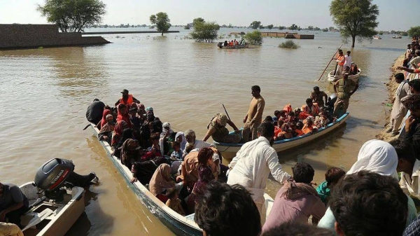Rescuers have to go door-to-door to relocate villagers by boats