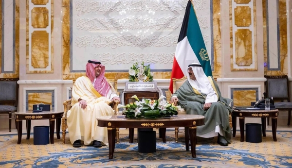 Amir of Kuwait Sheikh Meshal Al-Ahmad Al-Jaber Al-Sabah holds talks with Saudi Minister of Interior Prince Abdulaziz bin Saud bin Naif at Bayan Palace in Kuwait city on Sunday.