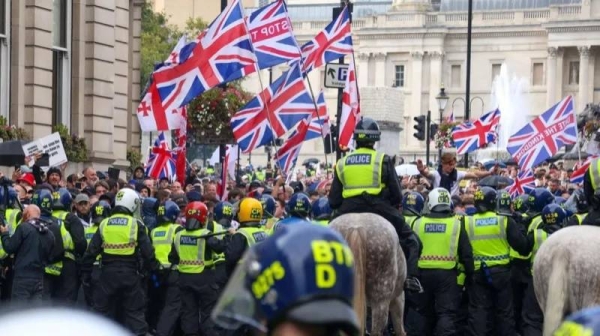 Starmer vows UK flag will not be surrendered to hate after far-right march in London