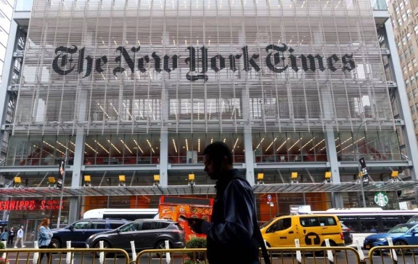 A person walks past the New York Times headquarters on 8th Avenue in New York City on May 16, 2024