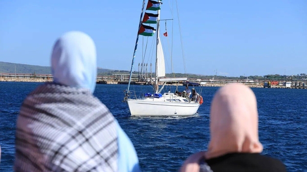 Supporters watch as a boat that is part of the Global Sumud Flotilla departs to Gaza to deliver aid, Tunisia, Saturday, Sept. 13, 2025