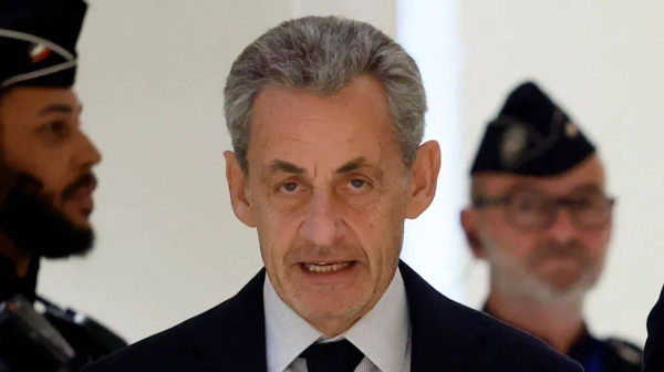 Nicolas Sarkozy arrives for the verdict in his trial on charges of corruption and illegal financing of an election campaign related to alleged Libyan funding of his successful 2007 presidential bid, at the courthouse in