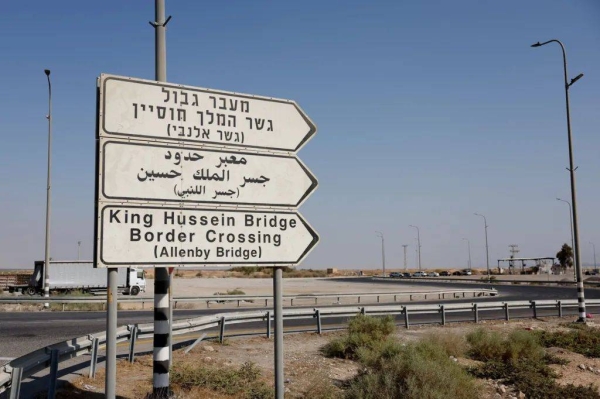 Road signs point to the currently closed Allenby Bridge Crossing between West Bank and Jordan, in the Israeli-occupied West Bank