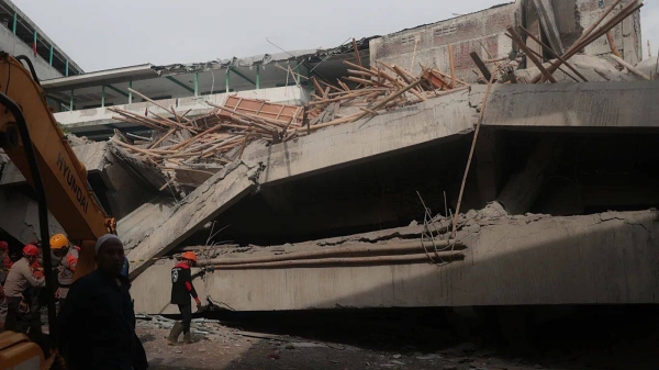 Rescuers search for survivors after a building under construction collapsed, at an Islamic boarding school in Sidoarjo, East Java, Indonesia, Tuesday, Sept. 30, 2025
