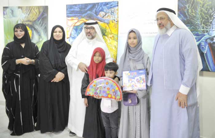 Elias and his sisters with members of the Saudi Association for Culture and Arts in Jeddah on Tuesday evening. — SG photo by Saleh Fareed